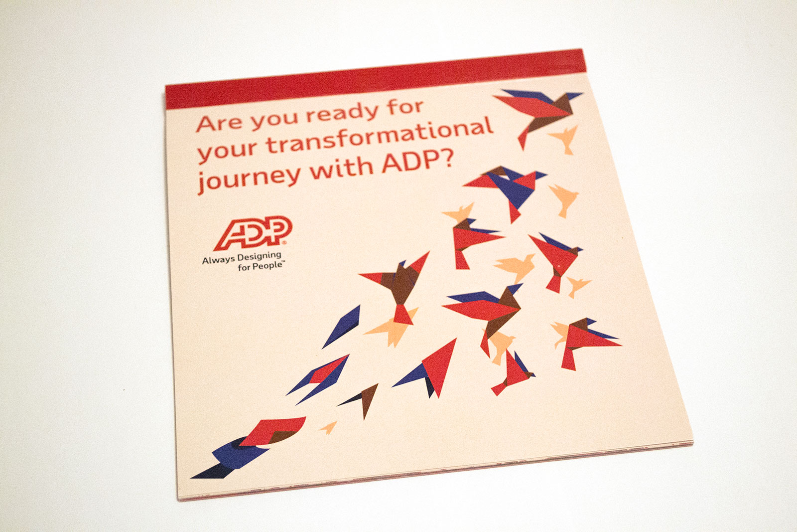 Origami book reads Are you ready for your transformational journey with ADP? with the ADP Always designing for people logo underneath