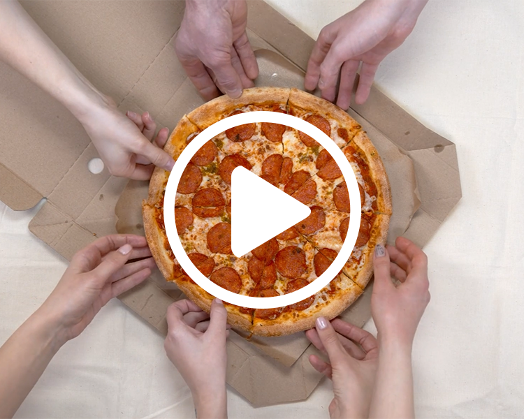 hands reaching towards a pepperoni pizza with a play button overlay